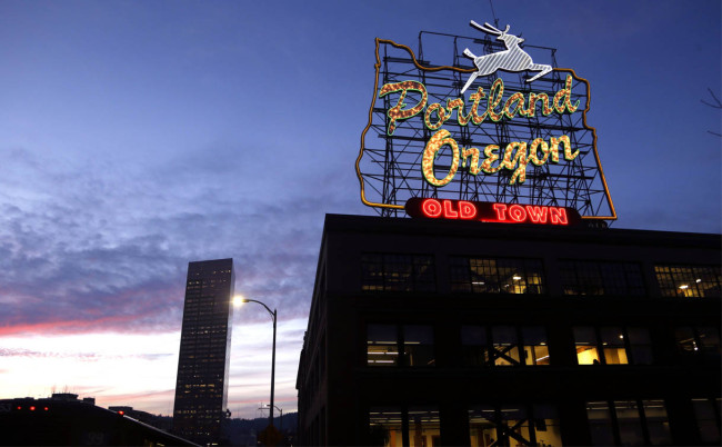This Tuesday, Jan. 27, 2015 photo shows the Portland, Oregon sign in downtown Portland, Ore. The city and Pabst in a dispute over the brewers use of the iconic sign to promote a music festival. (AP Photo/Don Ryan)