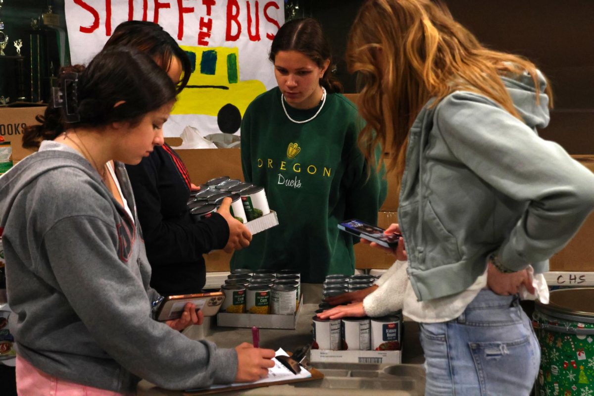 2022-2023 ASB students count Stuff the Bus donations, courtesy of CHS Yearbook