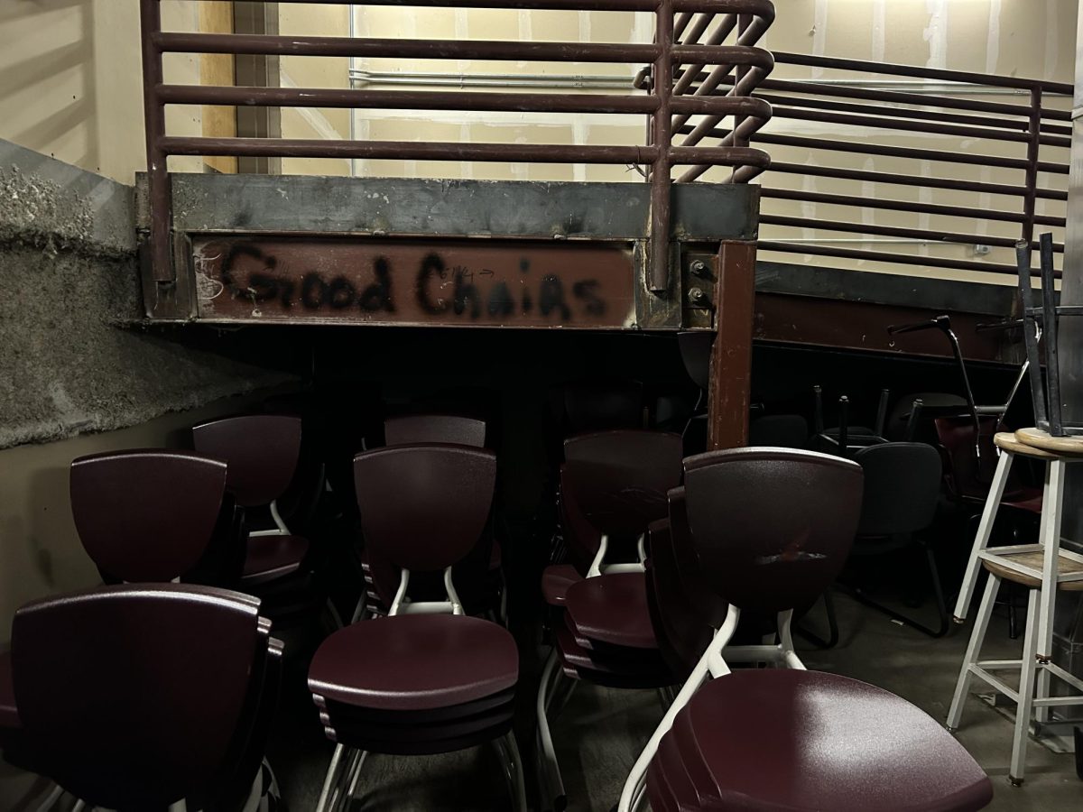 The CHS Chair Graveyard with graffiti reading good chairs