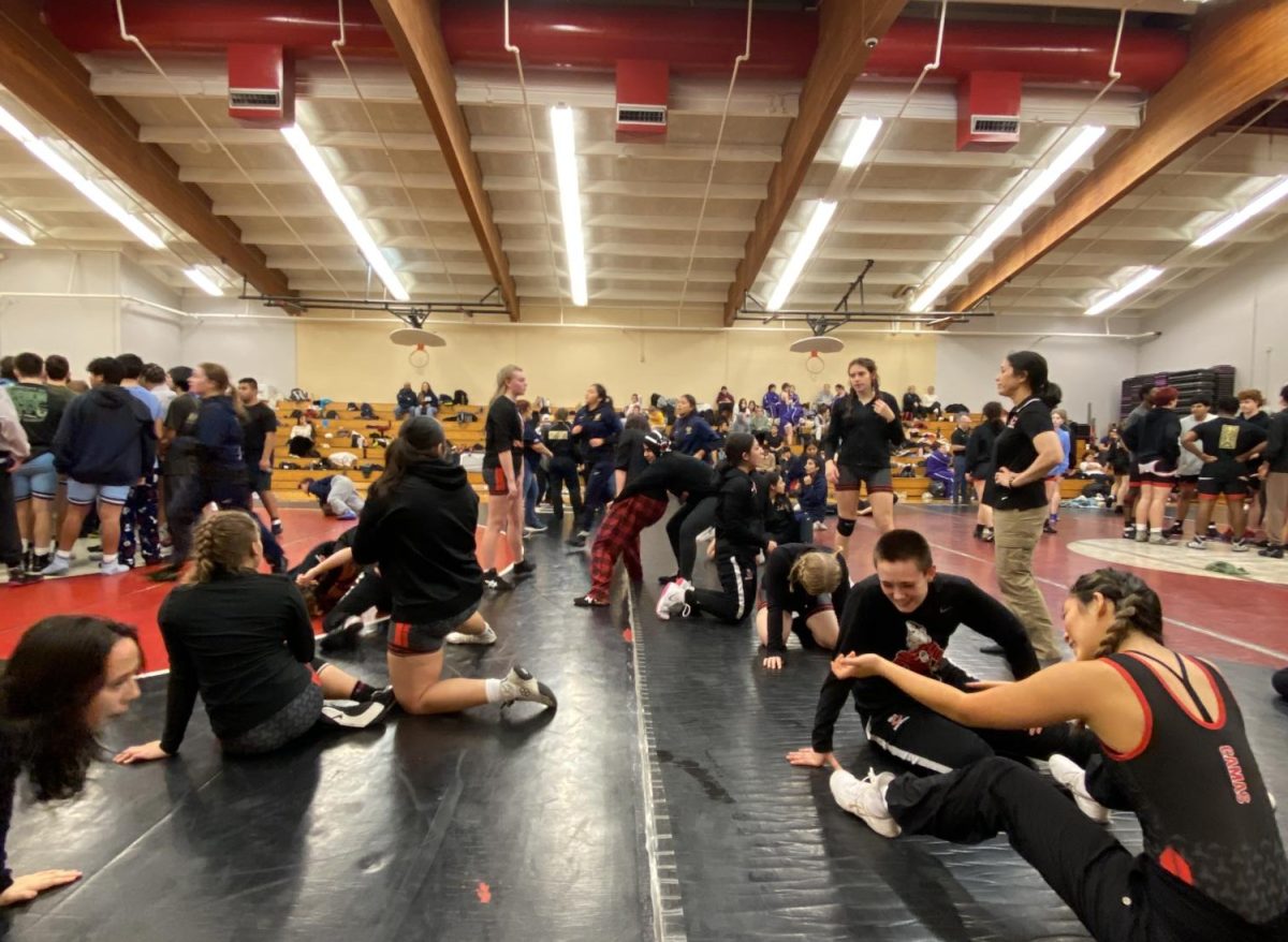CHS girls wrestling warming up for the Tyrone S. Woods Memorial tournament