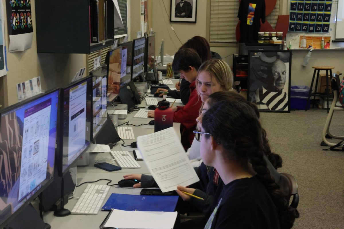 Students utilize technology in their graphic design class, courtesy of CHS Yearbook