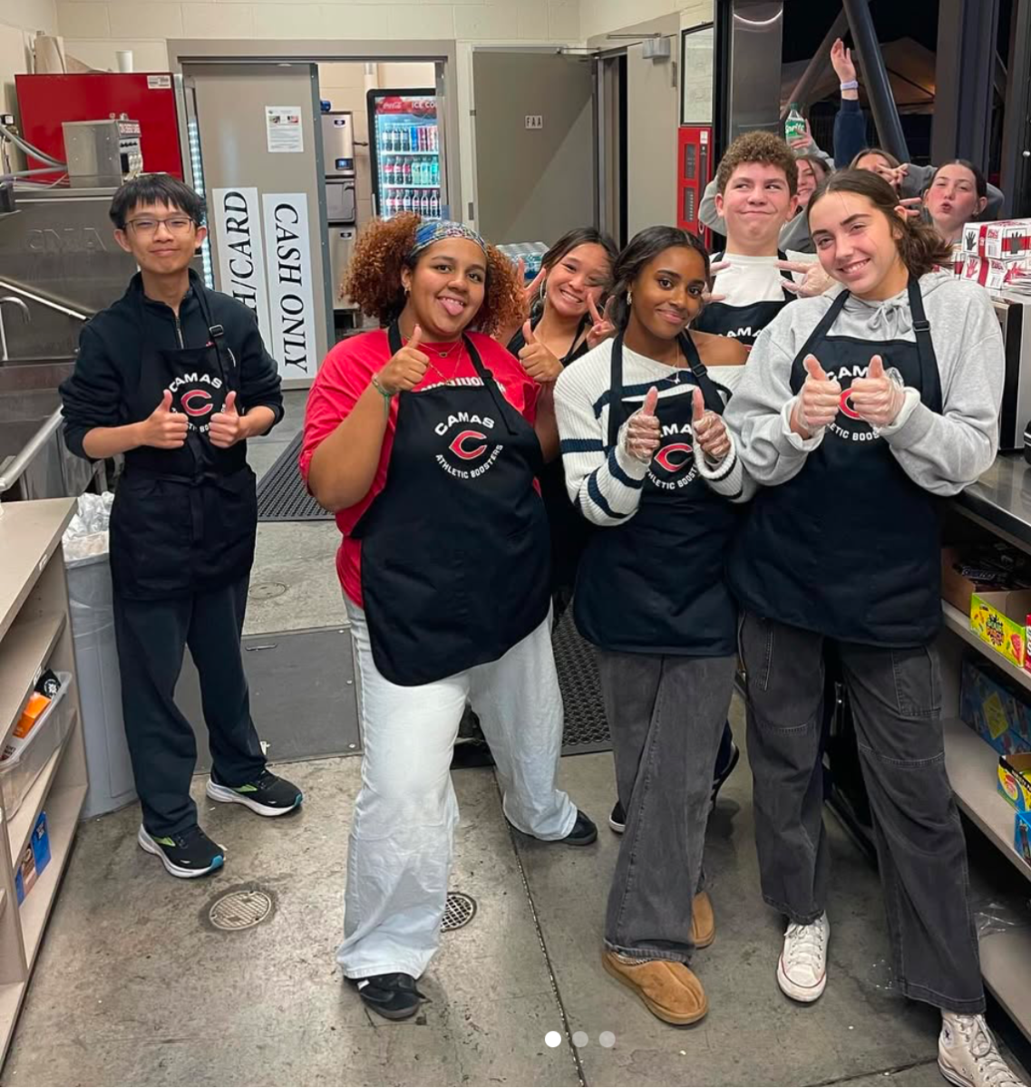 A group of CHS students working behind the scenes at a football game