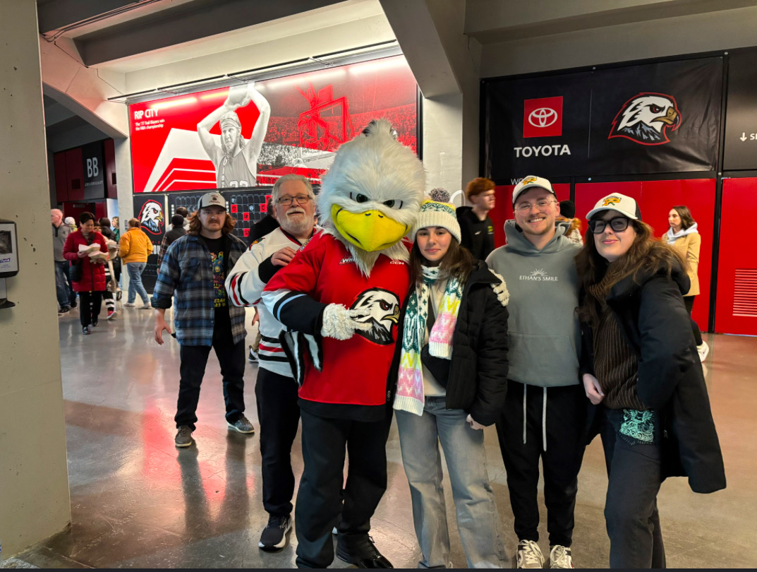 Sabrina Reia (right of duck) at a Portland Winterhawks game with her host family