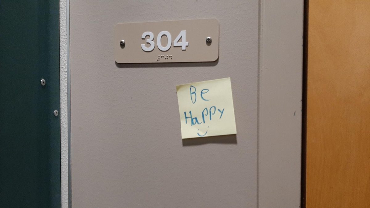 A sticky note encourages CHS students to 
"be happy"