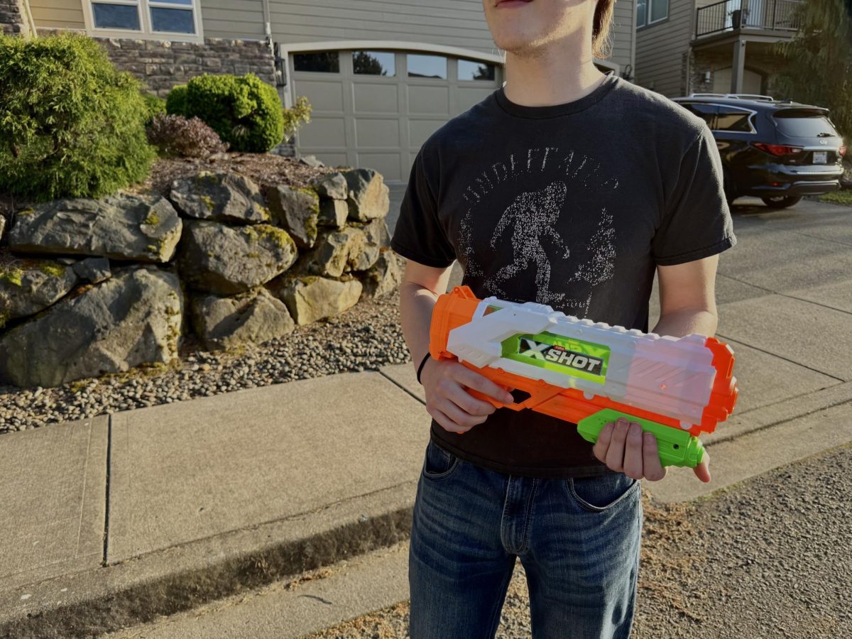 A participant poses with his weapon