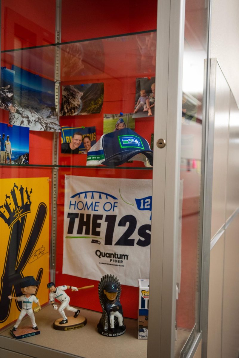 Display case outside of Brady Militech’s classroom, featuring a Seahawks hat and banner