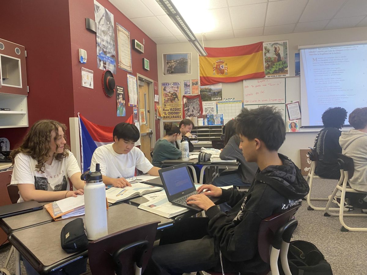 AP Spanish 4 students working on an assignment in class