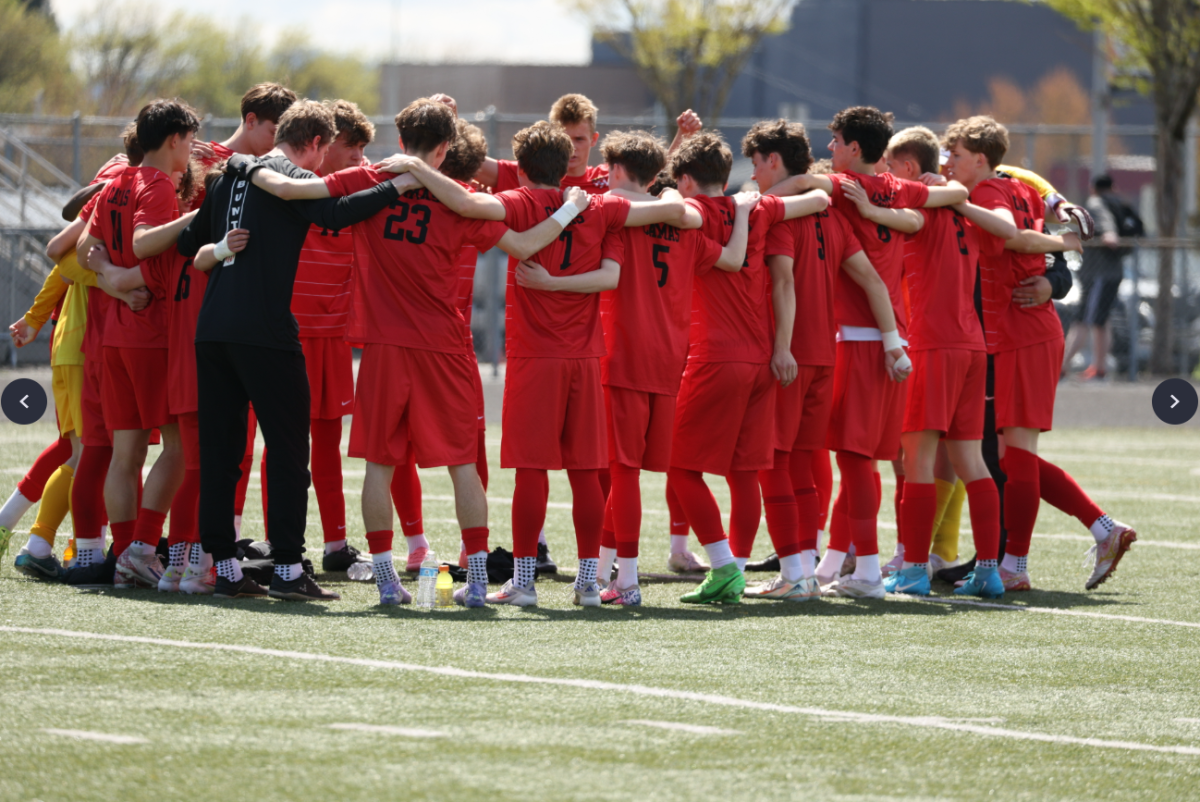 Boys soccer huddle before a game (courtesy of Lacamas Yearbook)