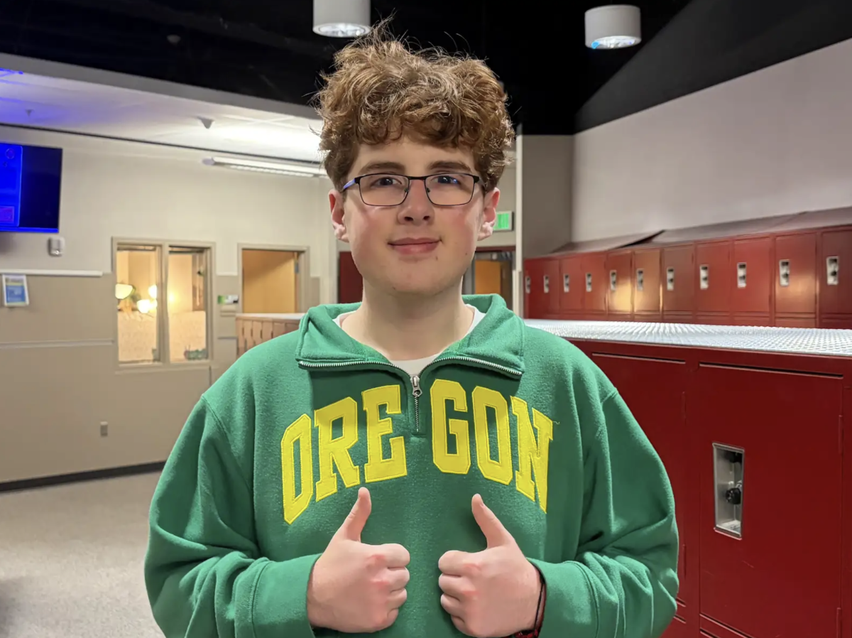 Luke Vollintine representing University of Oregon with a hoodie 