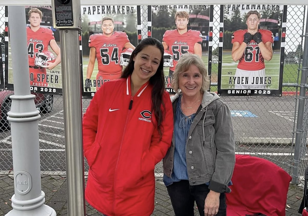 Seanna Pitassi and Karen Beasley welcoming in fans at a CHS event (courtesy of Camas Athletic Boosters)